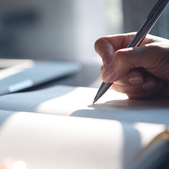 Person writing in a notebook