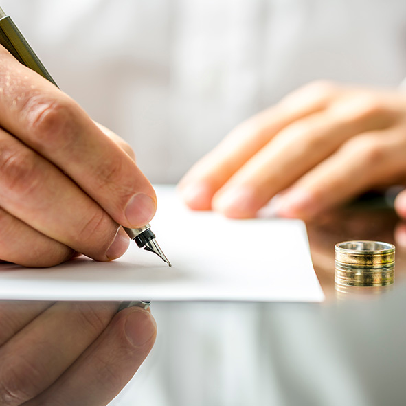 Person writing out divorce papers