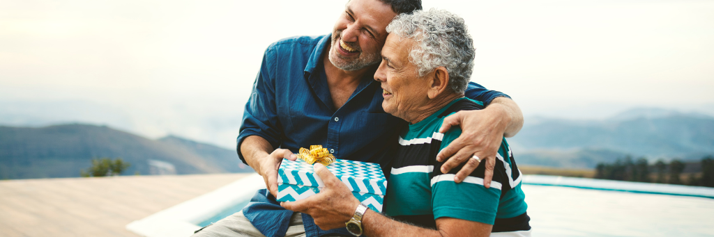 Image of a father giving his son a gift