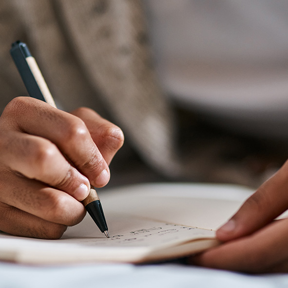 Person writing in a notebook