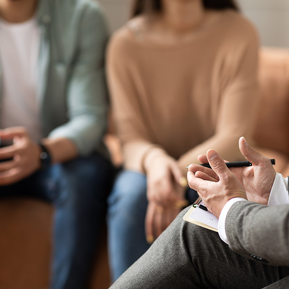 Young couple talking to lawyer