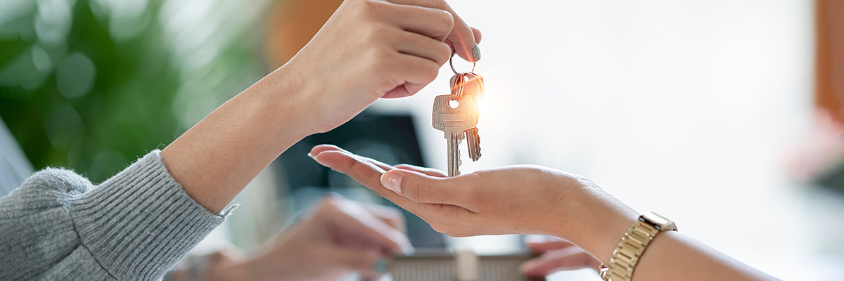 Why Do Conveyancers Require Proof of Source of Funds? - Picture of a set of keys being placed into an open hand.