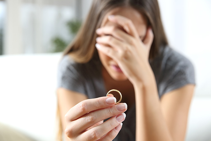 Why Your ‘Final Order’ Isn’t Final: Understanding Divorce Terminology in 2025 - Picture of a woman holding her wedding ring.